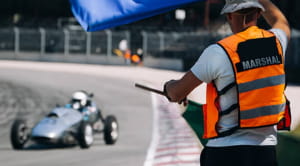 Marshall waving a flag